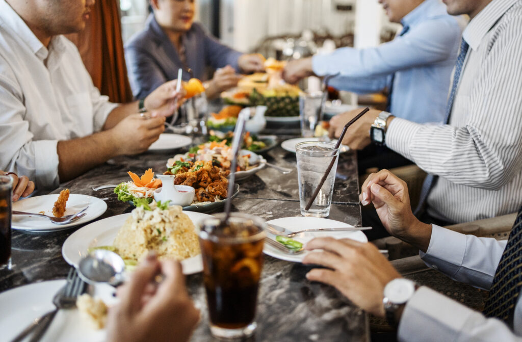 Business Professionals At A Restaurant Having Dinner
